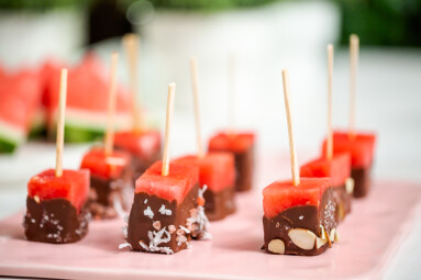 Preparing,Watermelon,Appetizers,Dipped,In,Chocolate,And,Sprinked,With,Sea