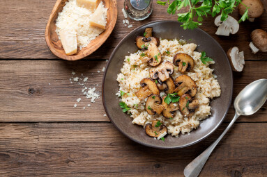 Risotto,With,Brown,Champignon,Mushrooms,On,Wooden,Background.,Top,View
