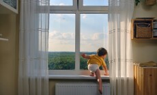 The,Little,Baby,Is,Dangerously,Climbing,Up,The,Window,Sill,