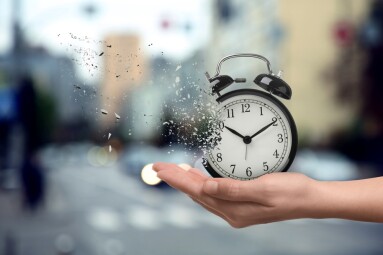 Time,Running,Out.,Woman,With,Dissolving,Alarm,Clock,On,Blurred