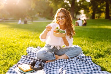 Woman,Enjoying,A,Poke,Bowl,On,A,Sunny,Day,In