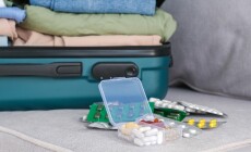 Clothes,And,Pills,In,A,Travel,Bag.,Concept,Of,Medication