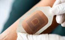 Close-up,Of,Gloved,Hands,Applying,A,Medical,Adhesive,Patch,To