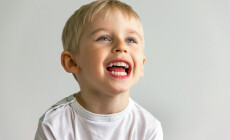 Cheerful,Boy,Laughing,Showing,White,Teeth,,Very,Soft,Focus