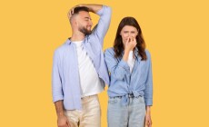 Man,Humorously,Sniffs,His,Armpit,And,Smiles,,While,Woman,Next