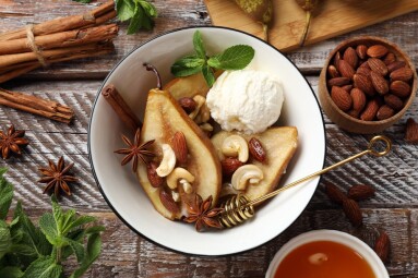 Delicious,Baked,Pears,With,Nuts,,Ice,Cream,,Anise,Stars,And