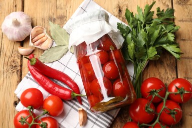 Tasty,Pickled,Tomatoes,In,Jar,And,Ingredients,On,Wooden,Table,