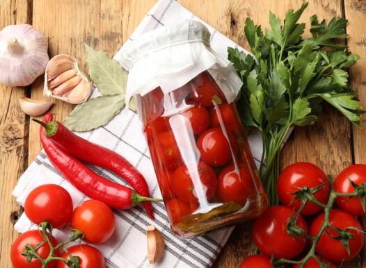 Tasty,Pickled,Tomatoes,In,Jar,And,Ingredients,On,Wooden,Table,
