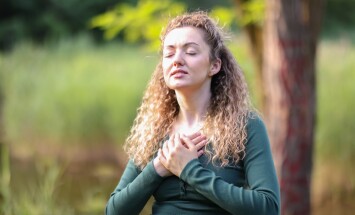 Relaxation,And,Harmony.,Happy,Woman,Meditating,In,Park
