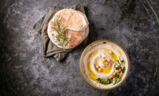 Home,Made,Hummus,Bowl,,Decorated,With,Boiled,Chickpeas,,Herbs,,Pita