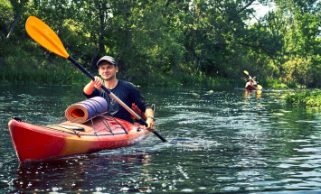 Group,Of,Young,People,On,Kayak,Outing,Rafting,Down,The
