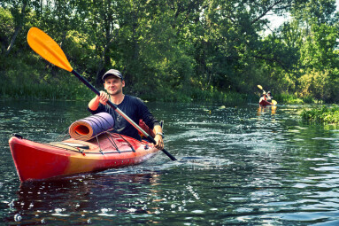 Group,Of,Young,People,On,Kayak,Outing,Rafting,Down,The