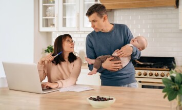 Young,Woman,Freelancer,Using,Laptop,,Working,From,Home,During,Maternity