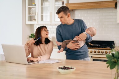Young,Woman,Freelancer,Using,Laptop,,Working,From,Home,During,Maternity