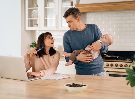 Young,Woman,Freelancer,Using,Laptop,,Working,From,Home,During,Maternity