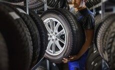 Hardworking,Experienced,Worker,Holding,Tire,And,He,Wants,To,Change
