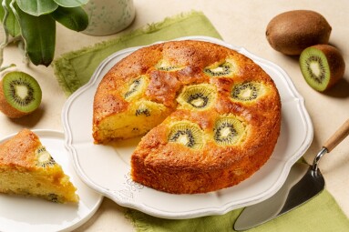 Slice,Of,Homemade,Fruit,Kiwi,Cake,,Sweet,Pie.,Beige,Table