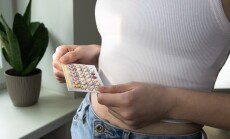 Woman,Taking,Birth,Control,Pills,,Holding,Oral,Contraceptive,Blister.,Preventing
