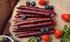 Tasty,Fruit,Leather,Rolls,,Strawberries,,Blueberries,And,Mint,On,Grey