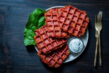 Vegetarian,Beetroot,And,Zucchini,Waffles,With,Herbs,On,A,Plate