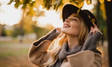 Happy,Young,Blonde,Woman,On,A,Sunny,Autumn,Day,Walking