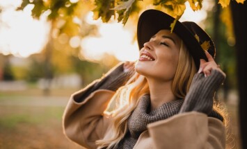 Happy,Young,Blonde,Woman,On,A,Sunny,Autumn,Day,Walking