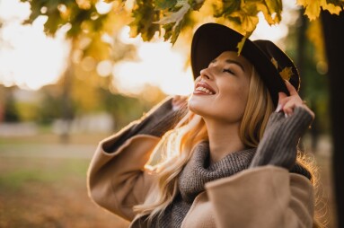 Happy,Young,Blonde,Woman,On,A,Sunny,Autumn,Day,Walking