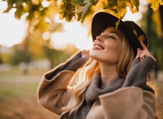 Happy,Young,Blonde,Woman,On,A,Sunny,Autumn,Day,Walking