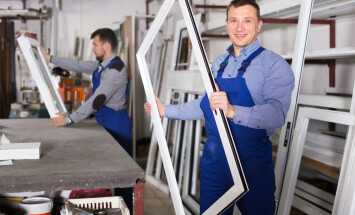 Smiling,Production,Workers,In,Coverall,With,Different,Pvc,Windows,And