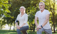 Portrait,Of,Active,Senior,Couple,Doing,Warm,Up,Exercises,While