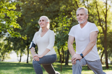 Portrait,Of,Active,Senior,Couple,Doing,Warm,Up,Exercises,While
