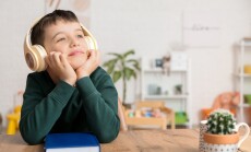 Little,Boy,Listening,To,Audiobook,At,Home