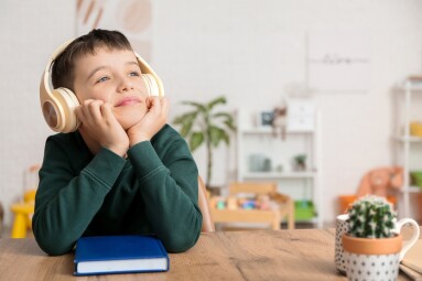 Little,Boy,Listening,To,Audiobook,At,Home
