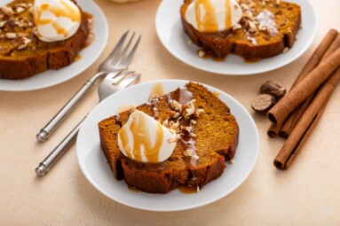 Pumpkin,Bread,Freshly,Baked,Topped,With,Whipped,Cream,,Pecans,And
