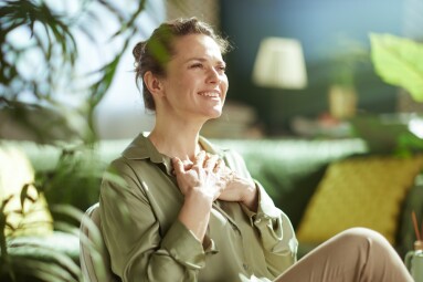 A,Serene,Woman,In,Her,40s,Holds,Her,Hands,Over