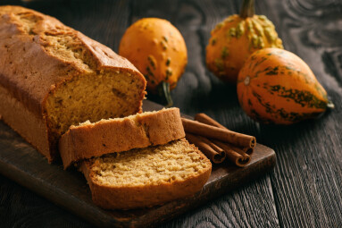Homemade,Pumpkin,Cake,On,Black,Wooden,Background.